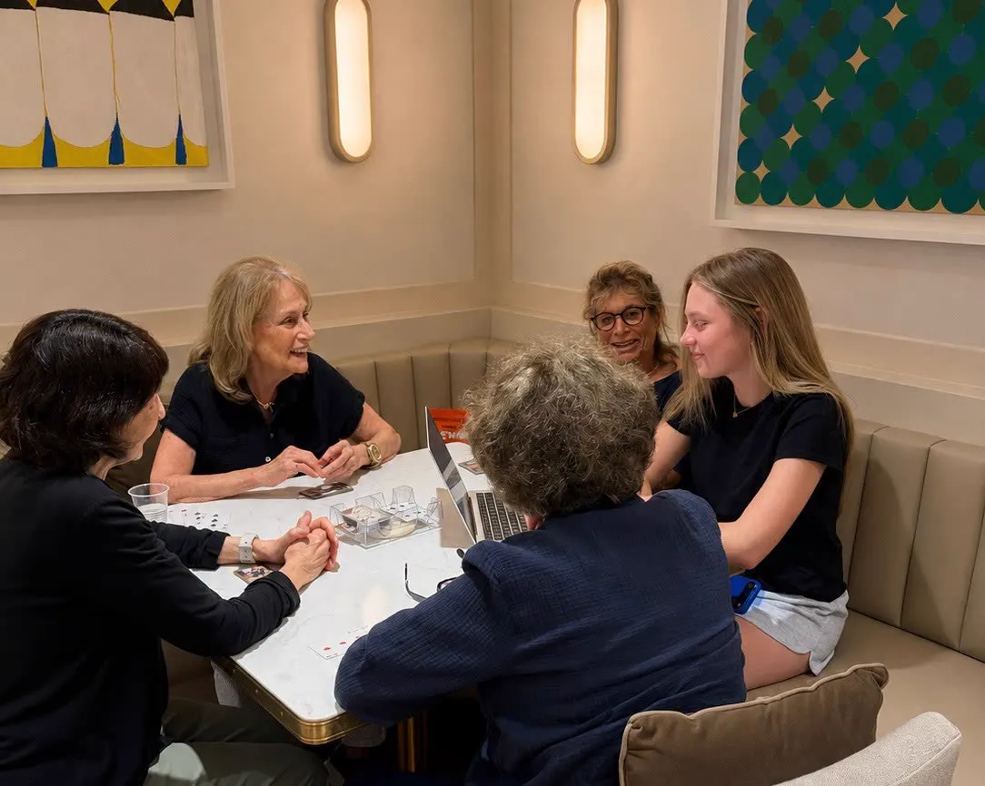 Allie leading a Tech Talk session with residents around a table